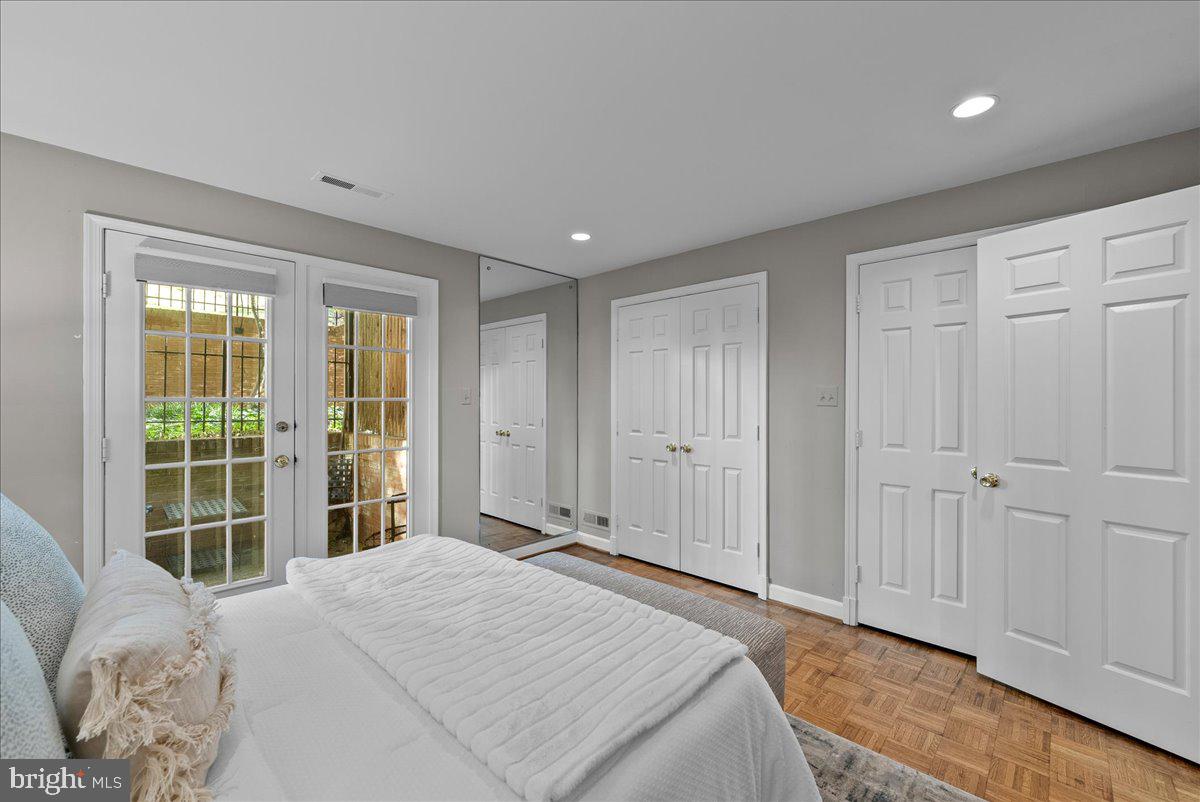 4625 MacArthur Boulevard Northwest, Unit A Washington, DC 20007 - Photo 11 of 14 a bedroom with a bed and a window