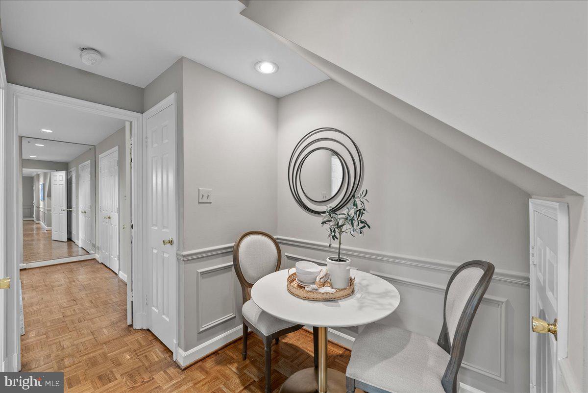 4625 MacArthur Boulevard Northwest, Unit A Washington, DC 20007 - Photo 5 of 14 a view of a dining room with furniture and a mirror