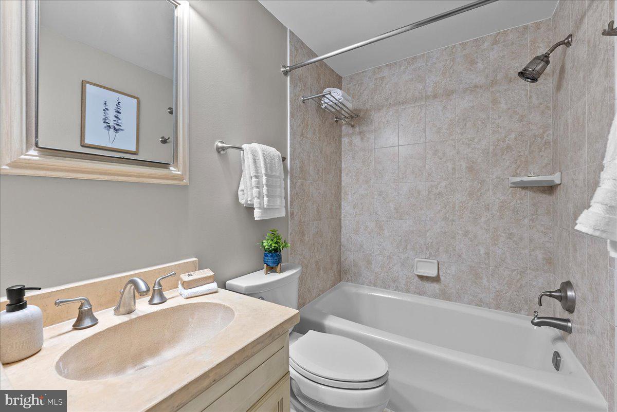 4625 MacArthur Boulevard Northwest, Unit A Washington, DC 20007 - Photo 9 of 14 a bathroom with a sink toilet and shower