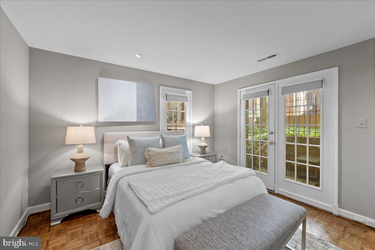4625 MacArthur Boulevard Northwest, Unit A Washington, DC 20007 - Photo 10 of 14 a bedroom with a bed and a large window