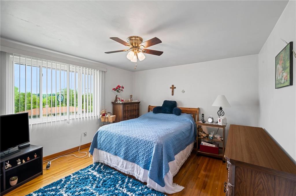 13680 Ridge Road Irwin, PA 15642 - Photo 17 of 40 a bedroom with a bed and a tv