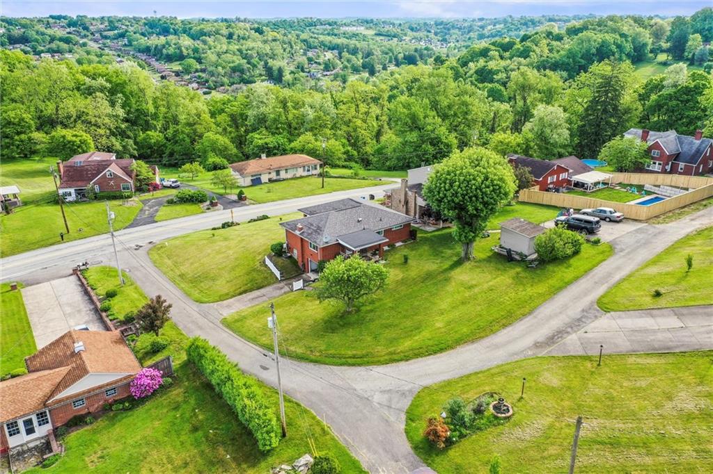 13680 Ridge Road Irwin, PA 15642 - Photo 32 of 40 an aerial view of a house with swimming pool patio and outdoor seating