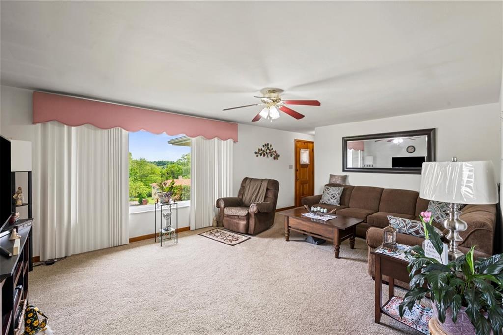 13680 Ridge Road Irwin, PA 15642 - Photo 5 of 40 a living room with furniture a window and a flat screen tv