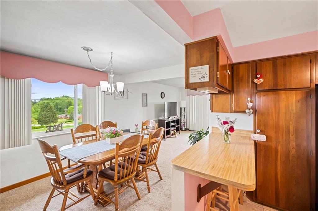 13680 Ridge Road Irwin, PA 15642 - Photo 8 of 40 a view of a dining room with furniture window and outside view