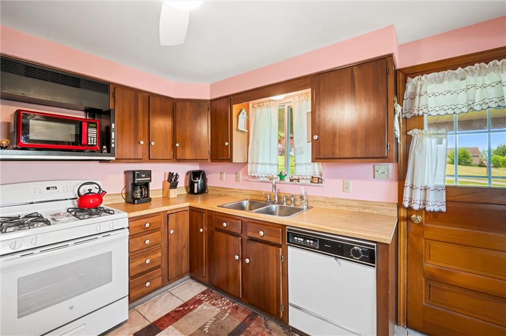 13680 Ridge Road Irwin, PA 15642 - Photo 10 of 40 a kitchen with a sink cabinets and window