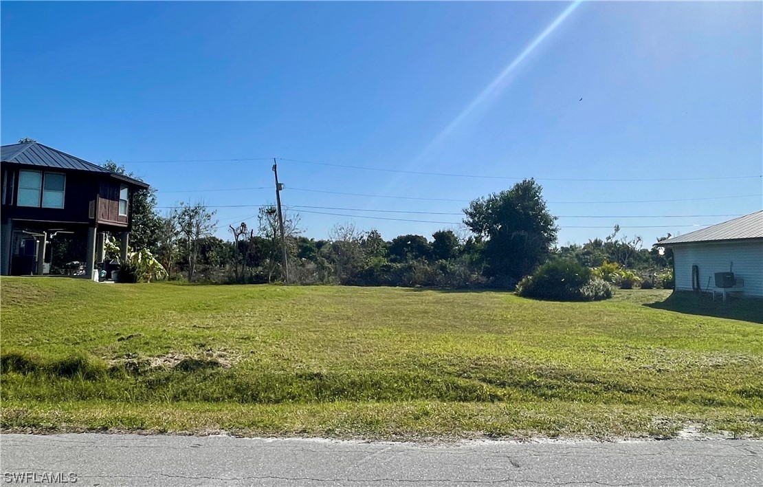 12086 Dolphin Road Bokeelia, FL 33922 - Photo 7 of 11 a view of a field with an ocean