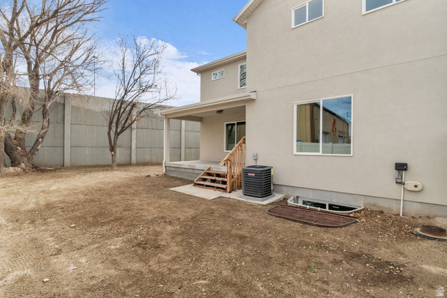 576 7th Avenue Midvale, UT 84047 - Photo 29 of 32 Back of house with a patio area and stucco siding