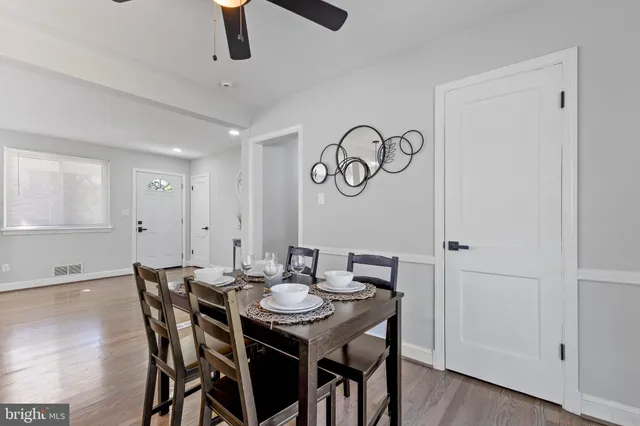 a view of a dining table and chairs in a room
