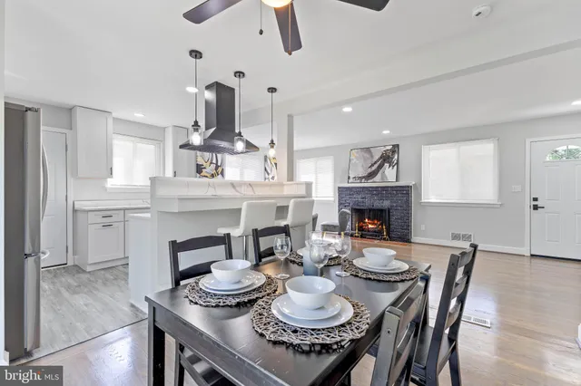 a dining room with furniture and a fireplace