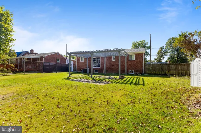 a view of house with a swimming pool