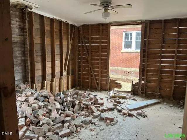 a view of a backyard with chairs