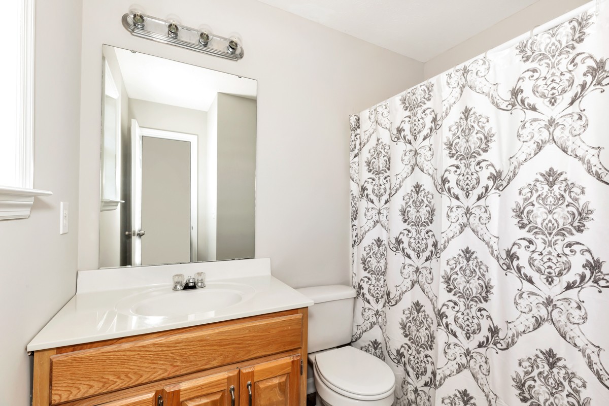 244 East Prospect Road Fayetteville, TN 37334 - Photo 14 of 24 a bathroom with a sink toilet and mirror