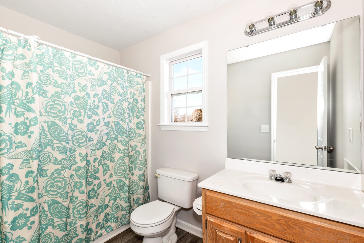 244 East Prospect Road Fayetteville, TN 37334 - Photo 17 of 24 a bathroom with a sink a toilet and shower curtain