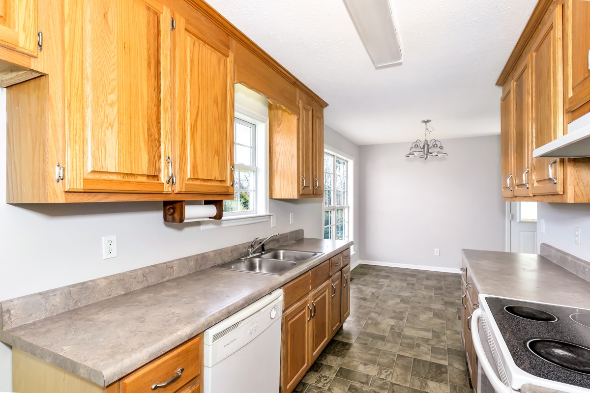 244 East Prospect Road Fayetteville, TN 37334 - Photo 4 of 24 a kitchen with a sink a stove and a microwave