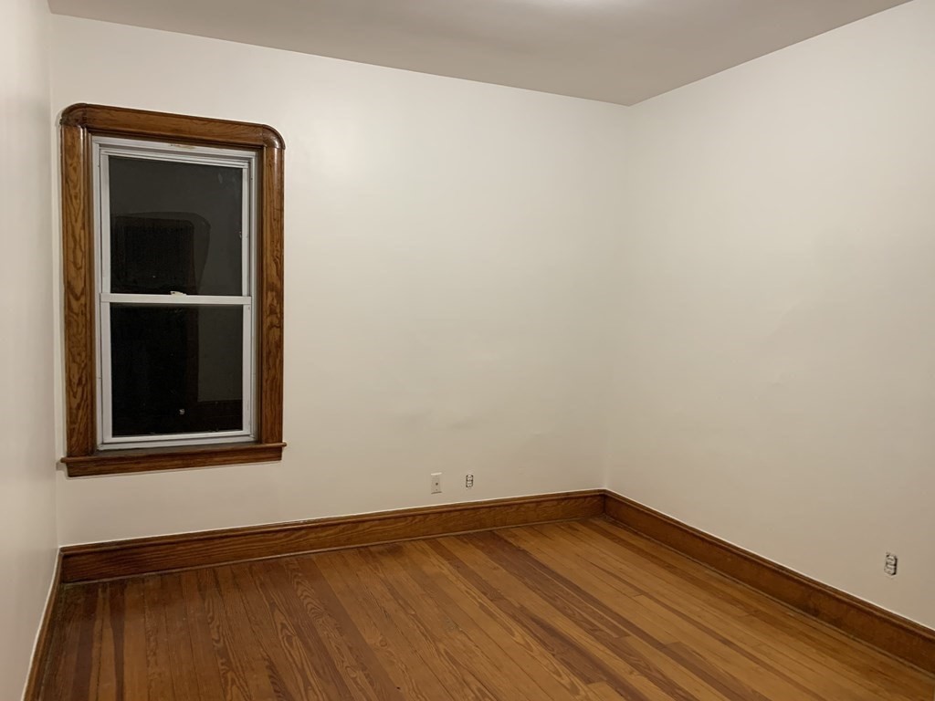 44 Crawford Street, Unit 3 Fall River, MA 02724 - Photo 5 of 8 a view of a small space with wooden floor and a window