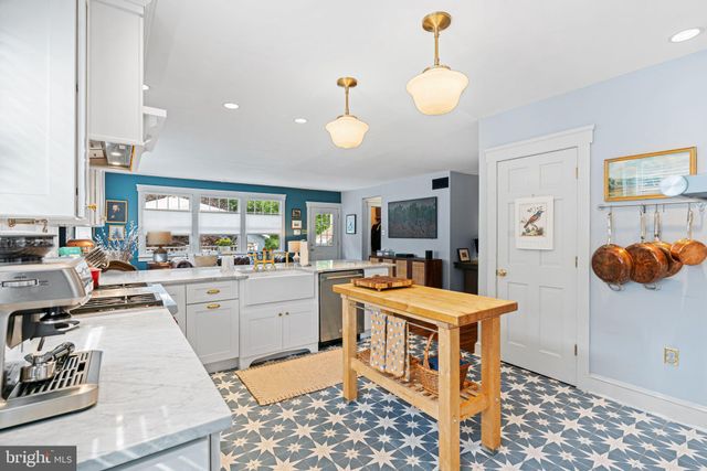 a room with furniture a flat screen tv and a window