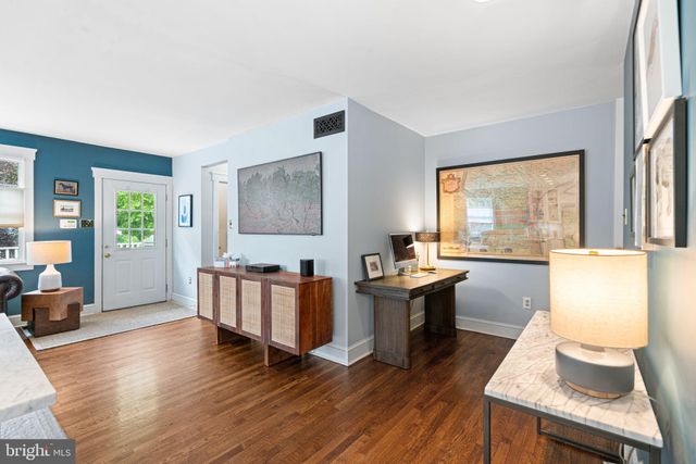 a view of a chairs and table on the wooden deck