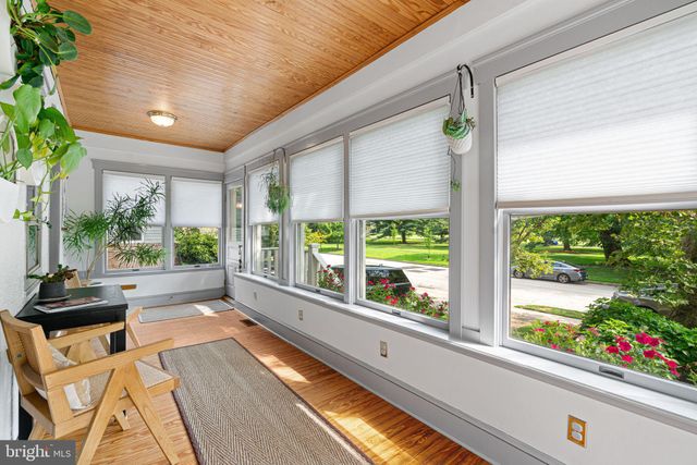 a view of a patio with a table and chairs