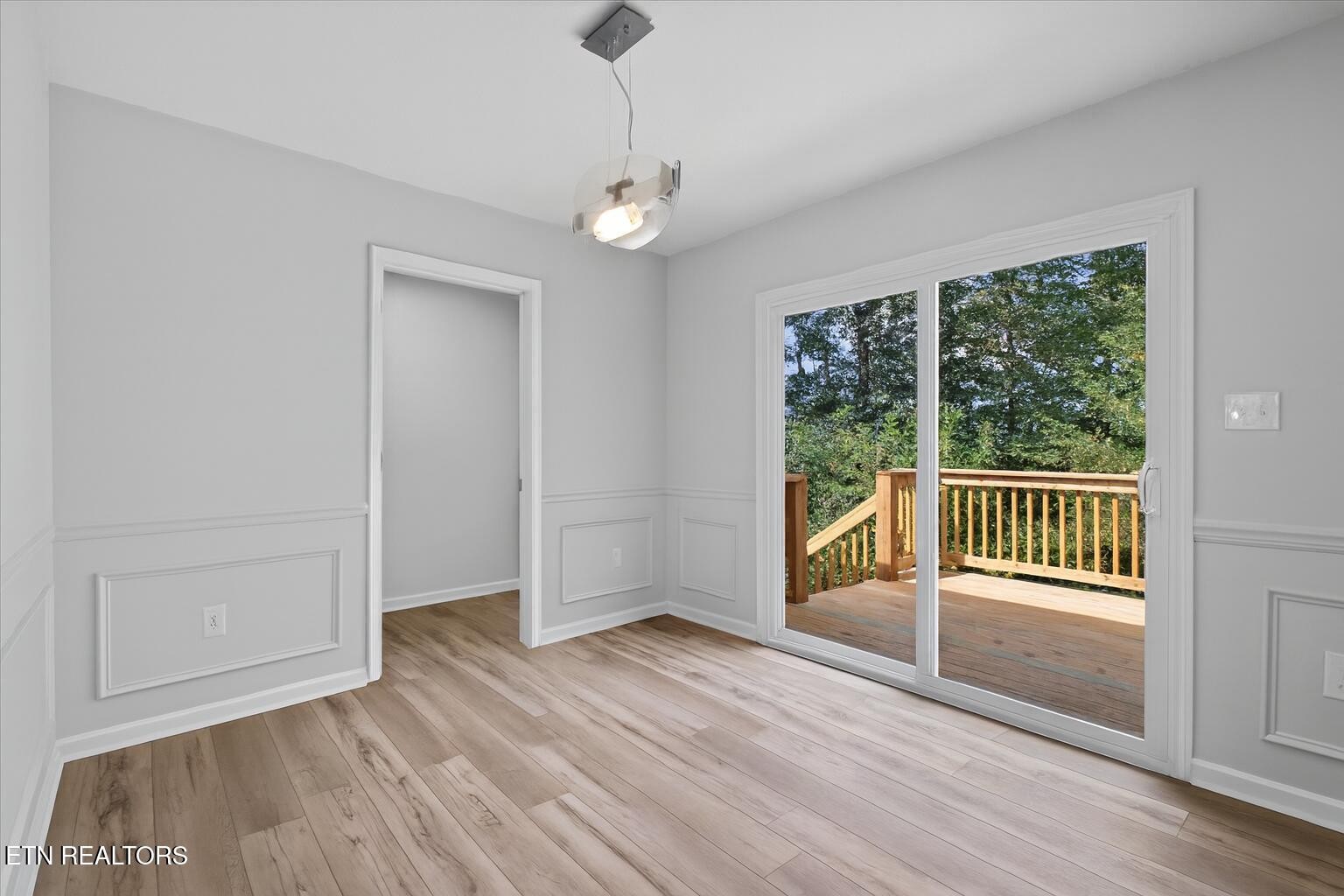 3844 Isaac Avenue Morristown, TN 37814 - Photo 4 of 23 an empty room with wooden floor and windows