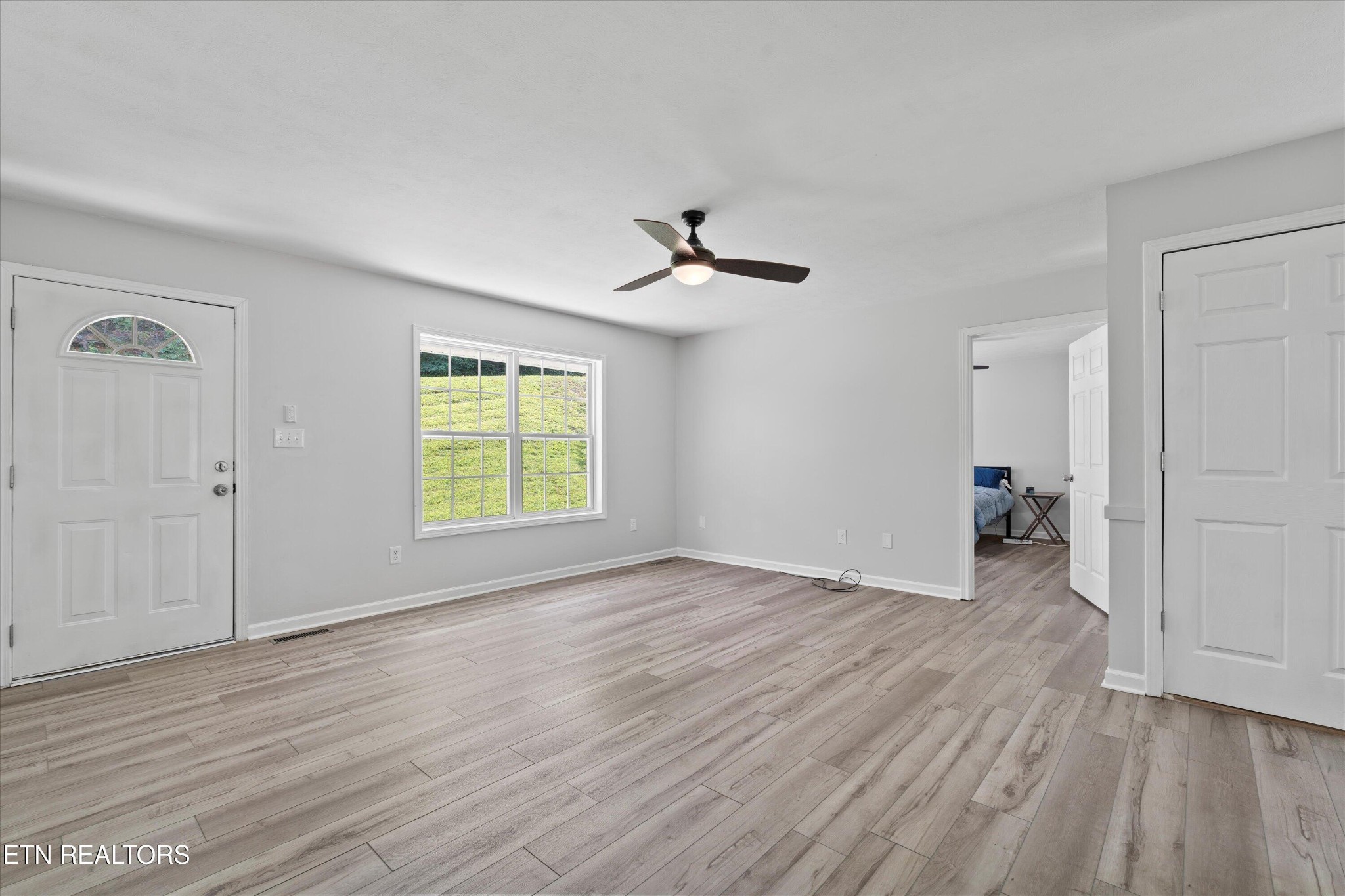 3844 Isaac Avenue Morristown, TN 37814 - Photo 5 of 23 a view of empty room with wooden floor and fan