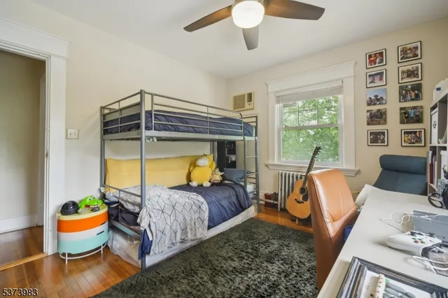 a bedroom with bed and balcony