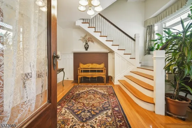 a view of entryway with wooden floor and a potted plant