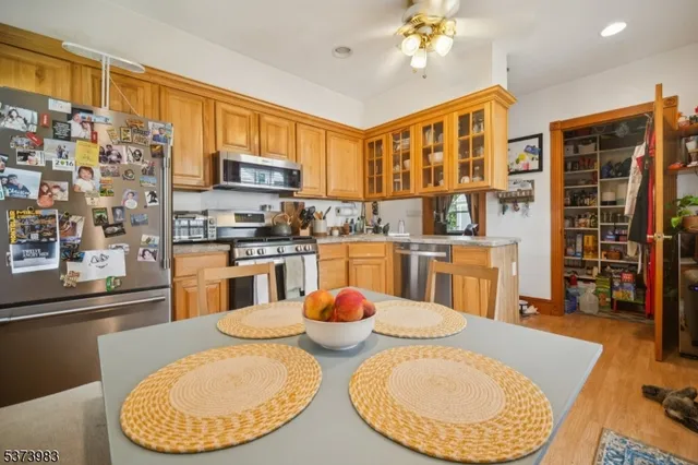 a kitchen with stainless steel appliances granite countertop a sink and cabinets