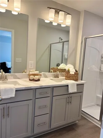 a view of a workspace with furniture and a window in a room