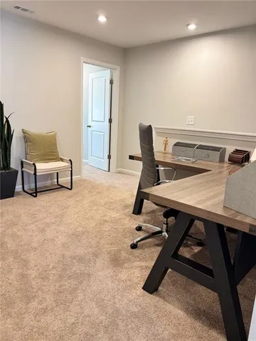 a workspace with furniture and window