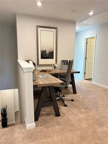 a bedroom with two beds and a large window