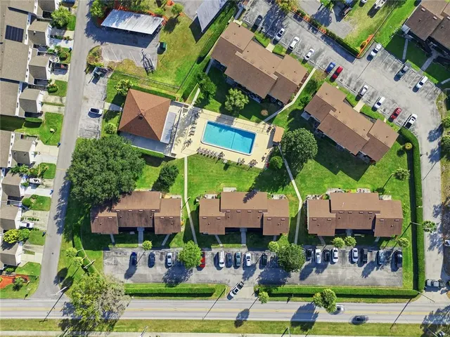 an aerial view of houses with yard