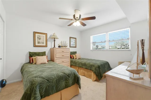 a bedroom with a bed and a table