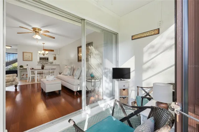 a living room with fireplace furniture and a flat screen tv
