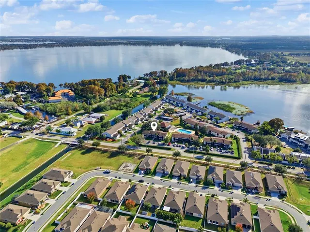 a view of a lake with a table and chairs