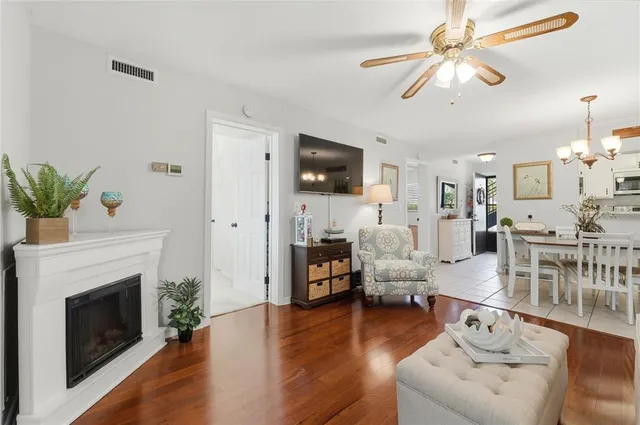 a living room with furniture fireplace and flat screen tv