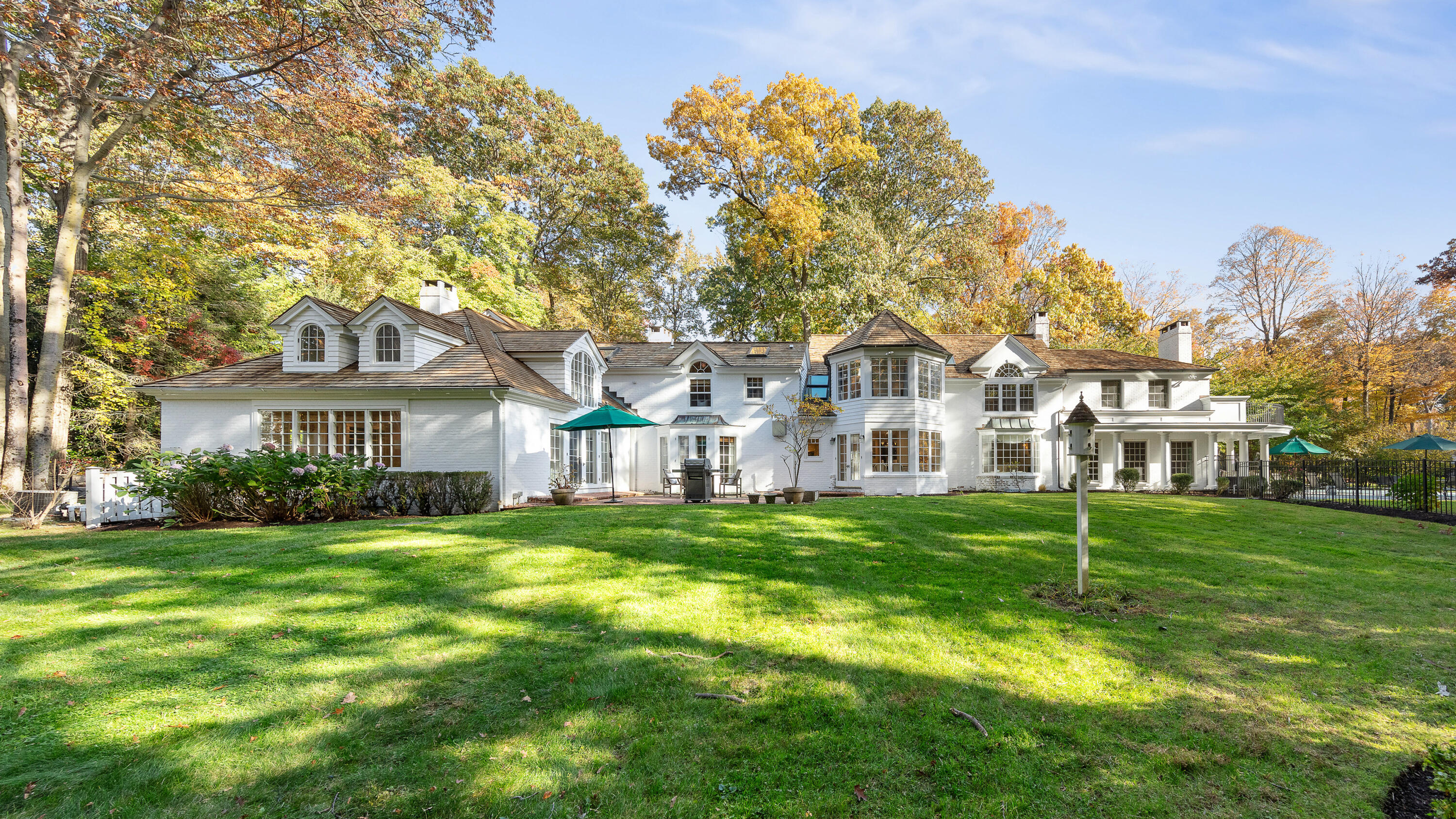 a front view of a building with a garden