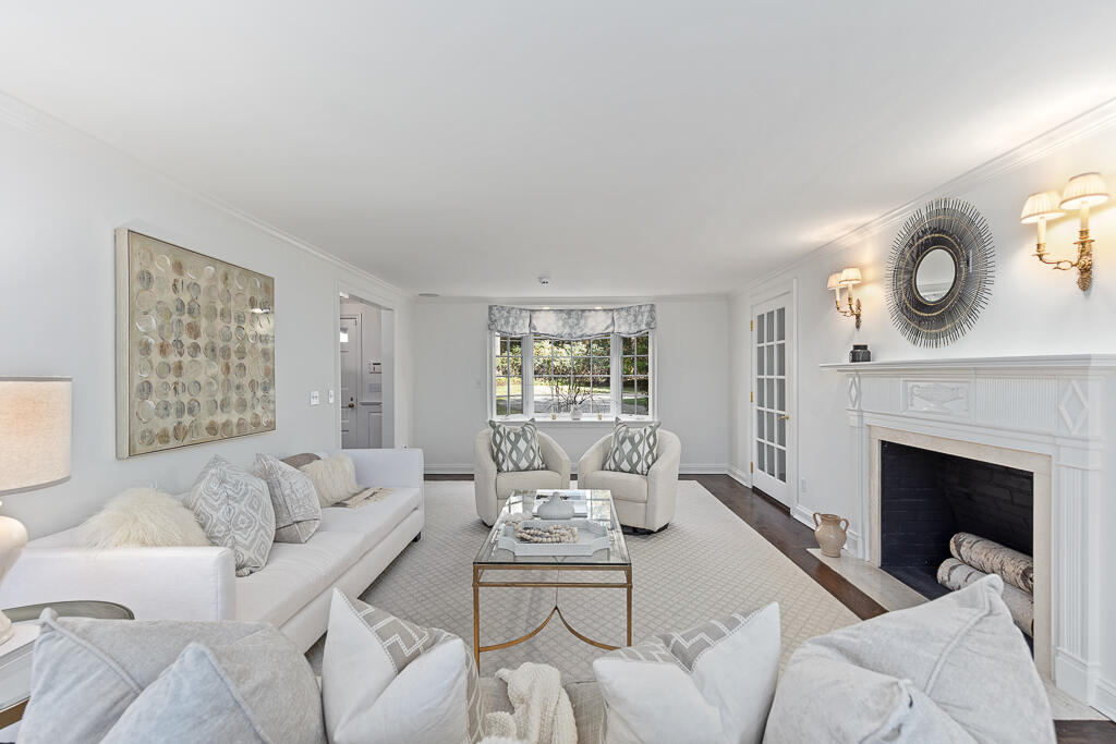 21 Halter Lane Darien, CT 06820 - Photo 14 of 45 a living room with furniture and a fireplace