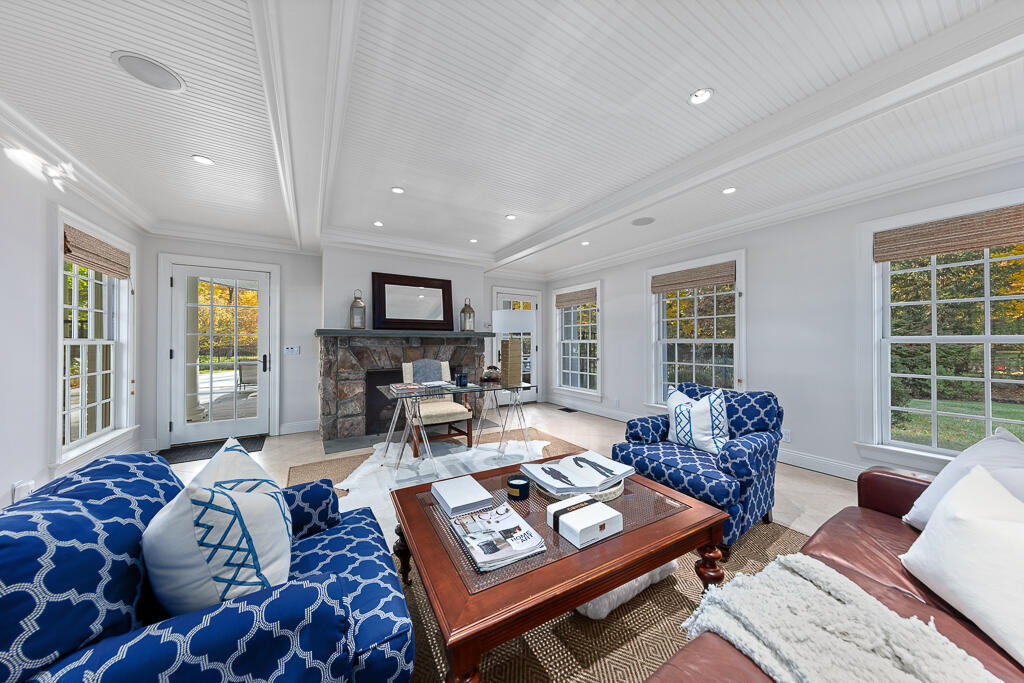 21 Halter Lane Darien, CT 06820 - Photo 16 of 45 a living room with furniture and a table