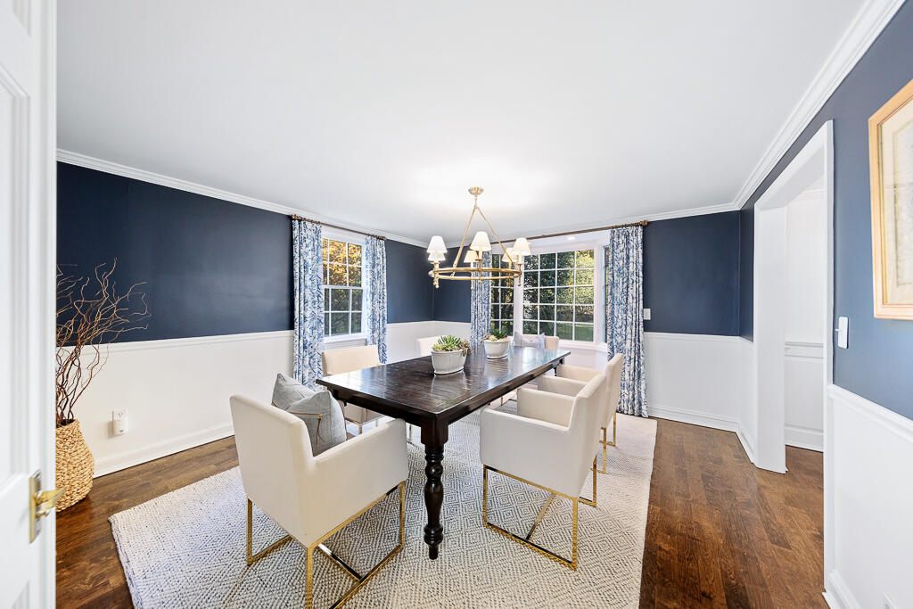 21 Halter Lane Darien, CT 06820 - Photo 18 of 45 a view of a dining room with furniture and wooden floor