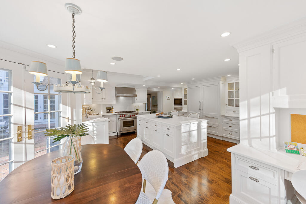 21 Halter Lane Darien, CT 06820 - Photo 19 of 45 a living room with furniture a kitchen island with wooden floor stainless steel appliances