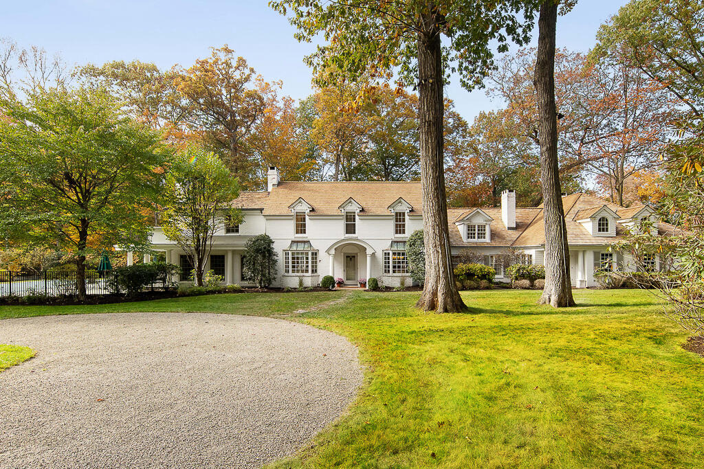 21 Halter Lane Darien, CT 06820 - Photo 2 of 45 a view of a house with a big yard and large trees