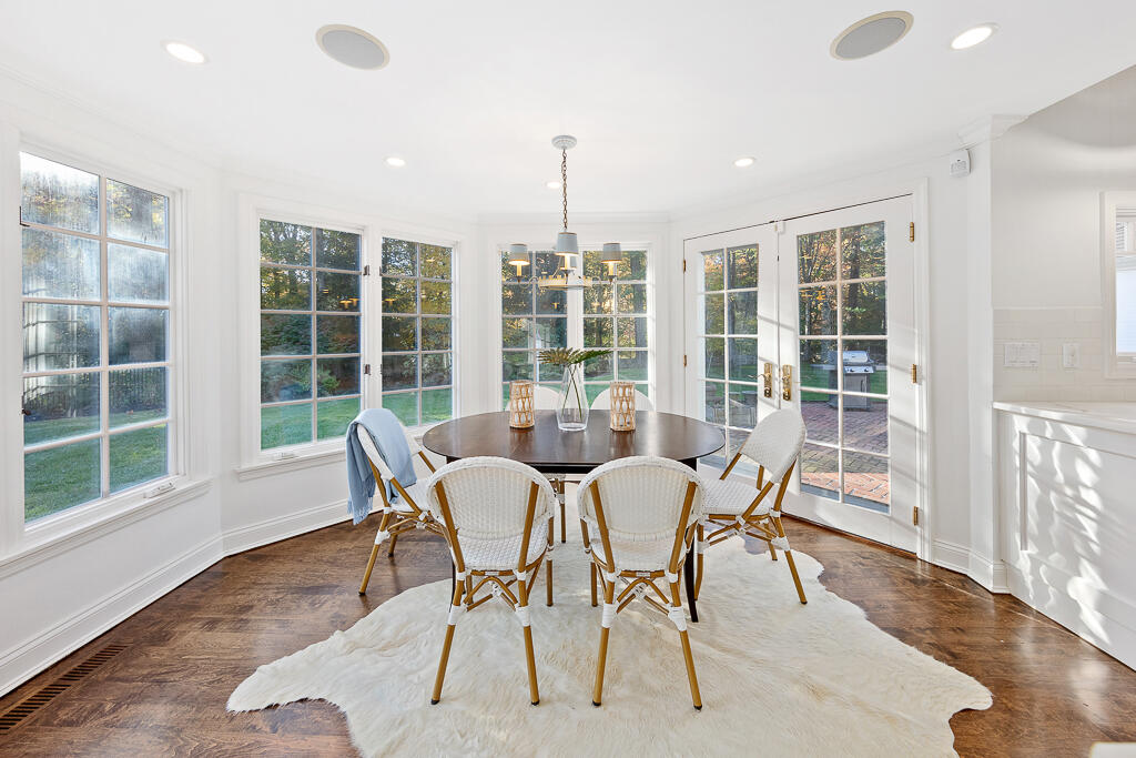21 Halter Lane Darien, CT 06820 - Photo 22 of 45 a view of a dining room with furniture window and outside view