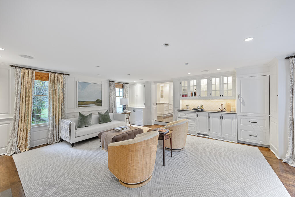 21 Halter Lane Darien, CT 06820 - Photo 24 of 45 a large living room with stainless steel appliances kitchen island granite countertop furniture and a large window