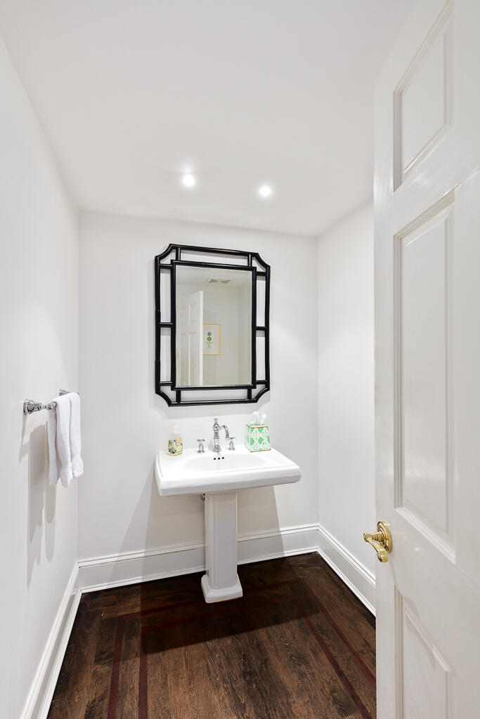 21 Halter Lane Darien, CT 06820 - Photo 26 of 45 a bathroom with a sink toilet and mirror