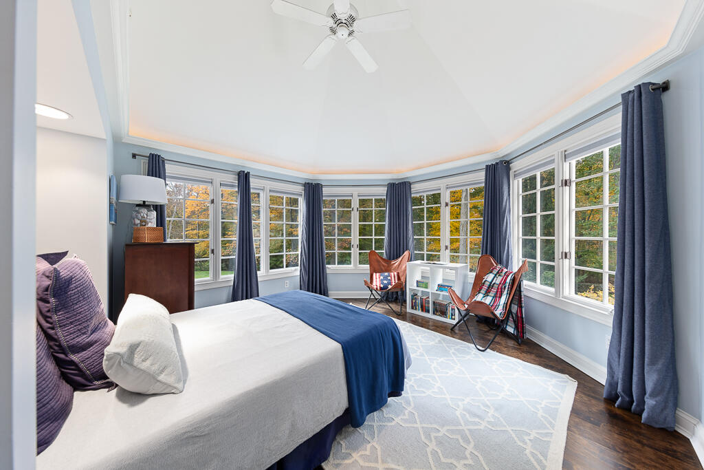 21 Halter Lane Darien, CT 06820 - Photo 31 of 45 a bedroom with a large bed and windows