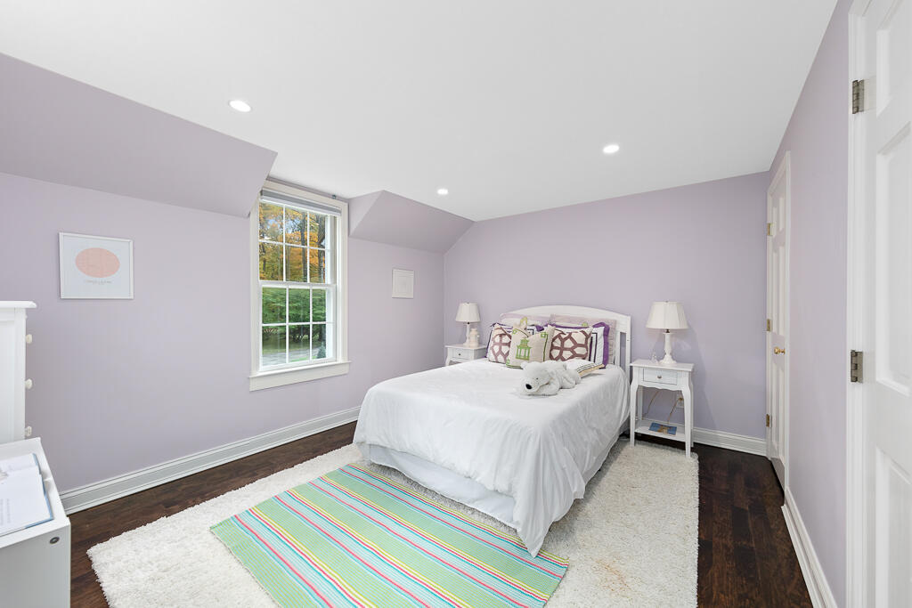 21 Halter Lane Darien, CT 06820 - Photo 33 of 45 a bedroom with a bed and a window