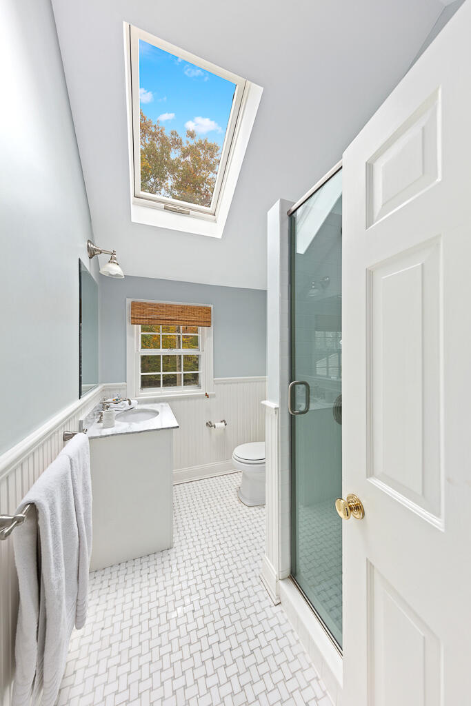 21 Halter Lane Darien, CT 06820 - Photo 34 of 45 a bathroom with a bathtub and a shower