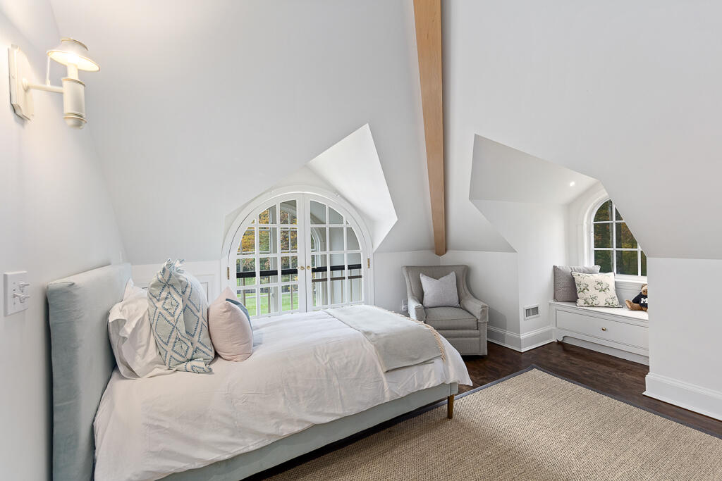 21 Halter Lane Darien, CT 06820 - Photo 40 of 45 a bedroom with bed and a large window