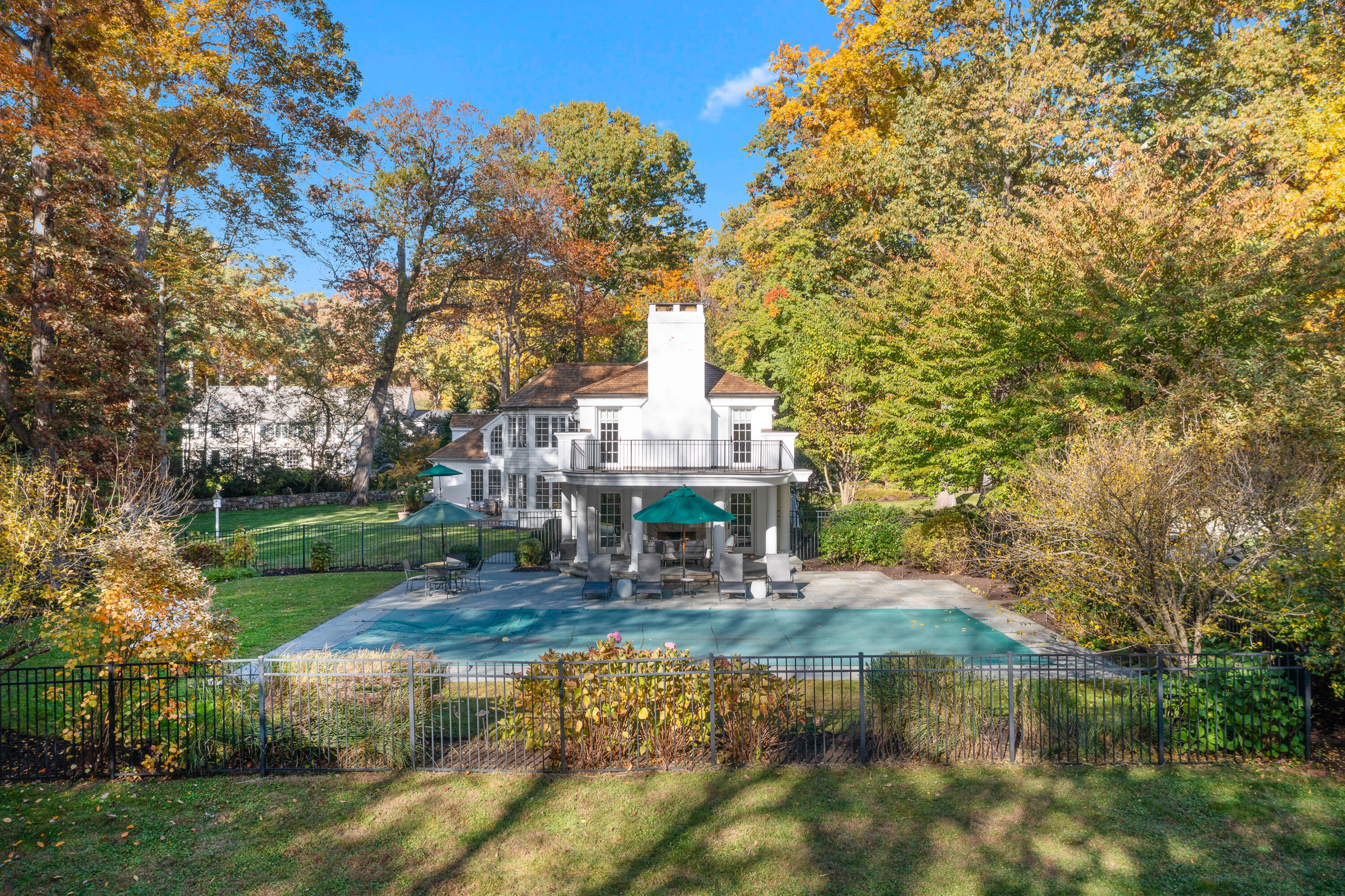 21 Halter Lane Darien, CT 06820 - Photo 9 of 45 a view of statue in front of a house with large trees