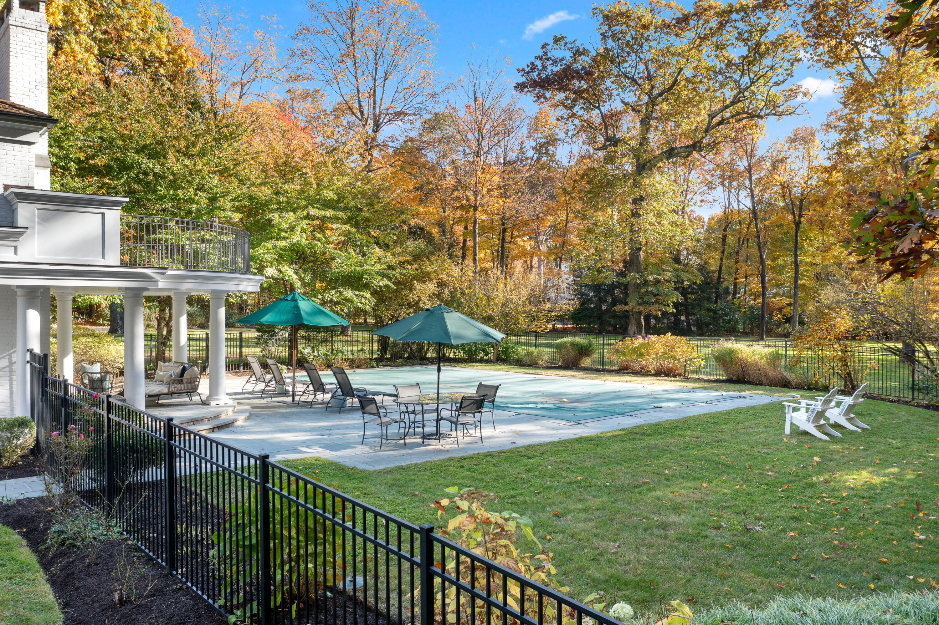 21 Halter Lane Darien, CT 06820 - Photo 10 of 45 a swimming pool with outdoor seating and yard